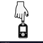 Hand holding glucometer
